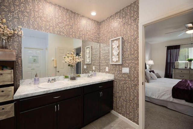 bathroom featuring ceiling fan, vanity, and tile patterned flooring