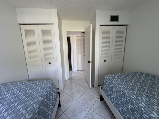 bedroom featuring a textured ceiling