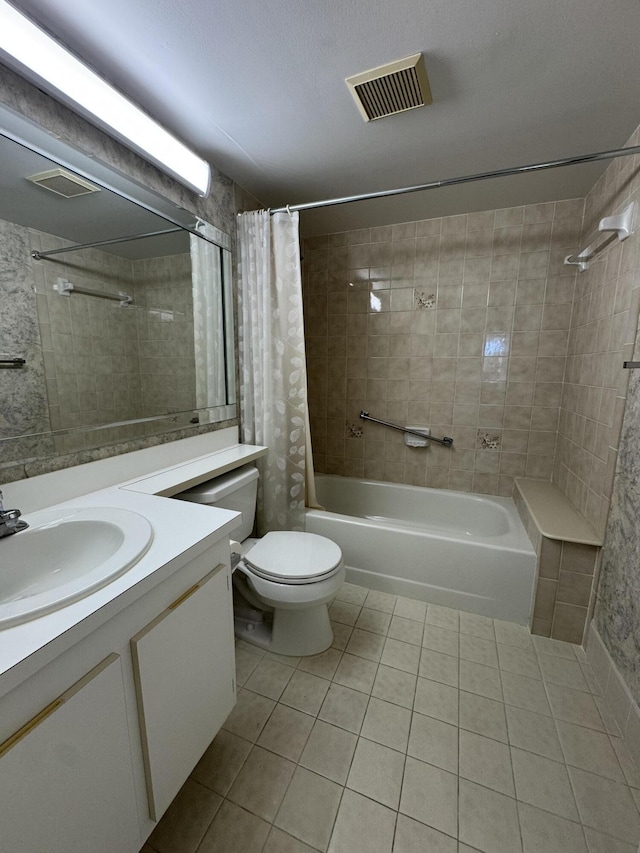 full bathroom featuring vanity, tile patterned floors, shower / bath combo with shower curtain, and toilet