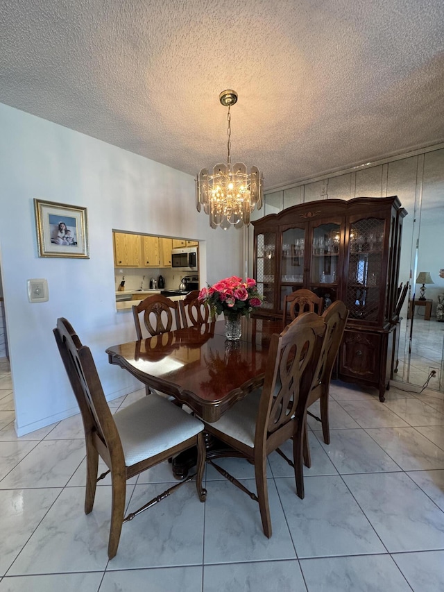 dining room featuring a textured ceiling and a notable chandelier