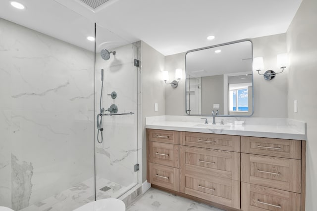 bathroom featuring vanity, toilet, and a shower with door