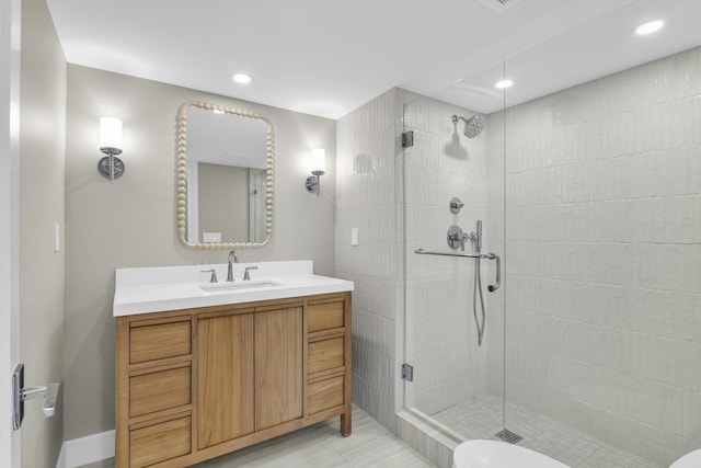 bathroom with walk in shower, vanity, and toilet