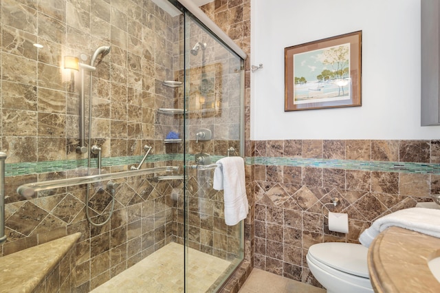 bathroom with an enclosed shower, tile walls, and toilet