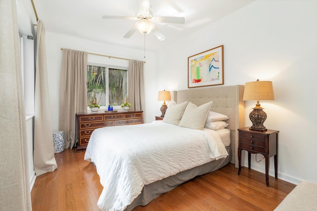 bedroom with ceiling fan and hardwood / wood-style floors