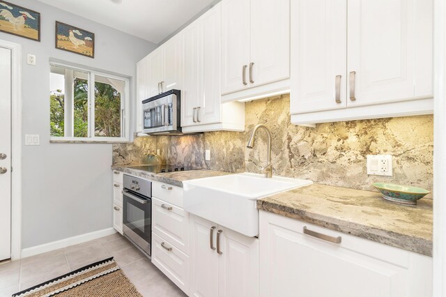 kitchen featuring white cabinetry, sink, and stainless steel appliances