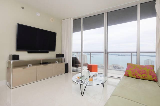 living room with floor to ceiling windows