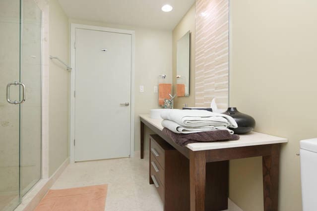 bathroom with vanity, toilet, and walk in shower