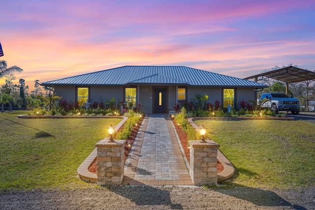 view of front of house with a lawn