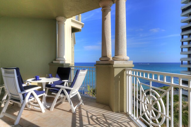 balcony featuring a water view