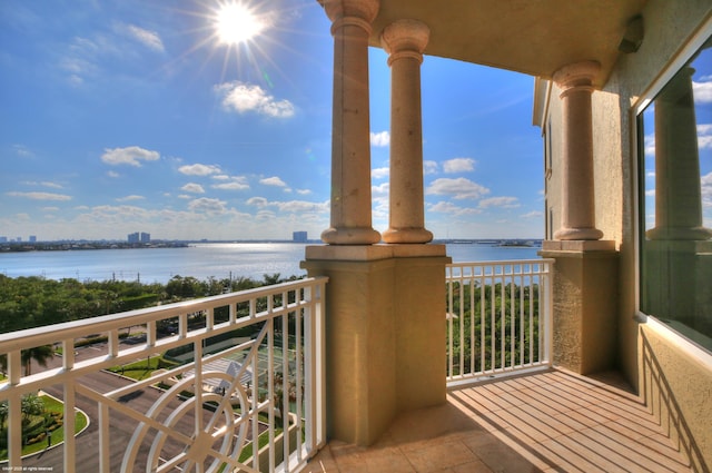 balcony featuring a water view