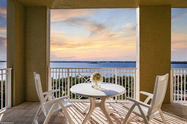 balcony at dusk with a water view