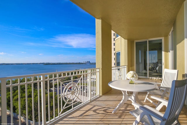 balcony featuring a water view