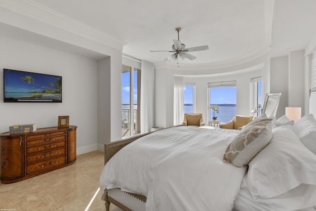 bedroom featuring crown molding, ceiling fan, and a water view