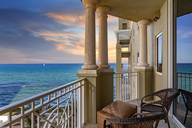 balcony at dusk with a water view