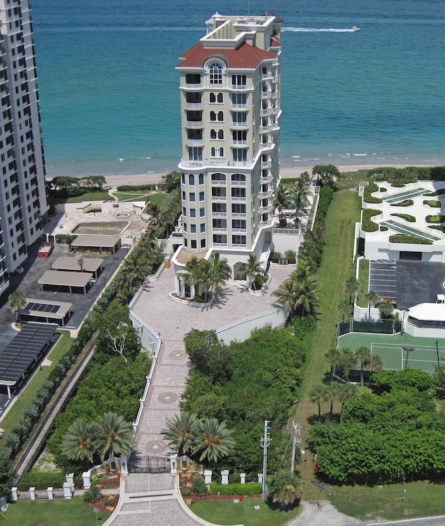 birds eye view of property featuring a view of the beach and a water view