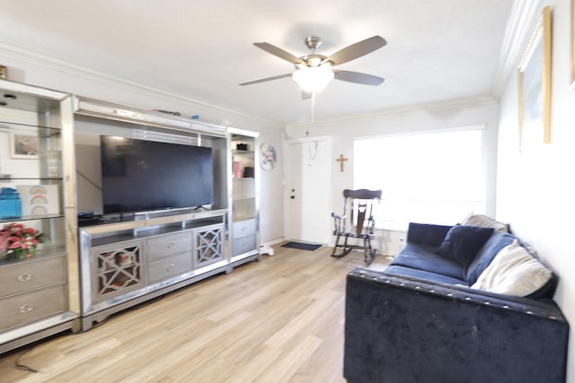 living room featuring crown molding, ceiling fan, and light wood-type flooring