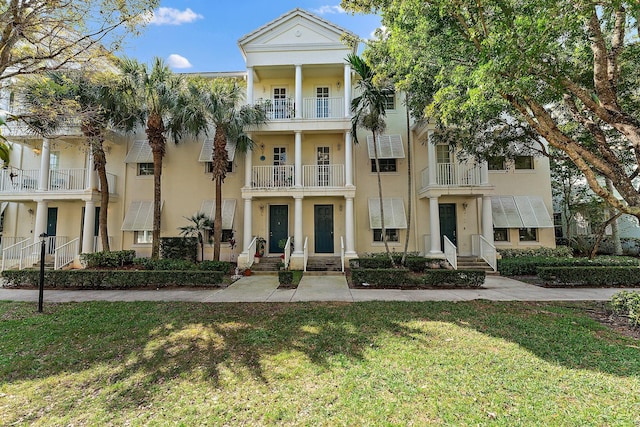 view of front of property with a front lawn