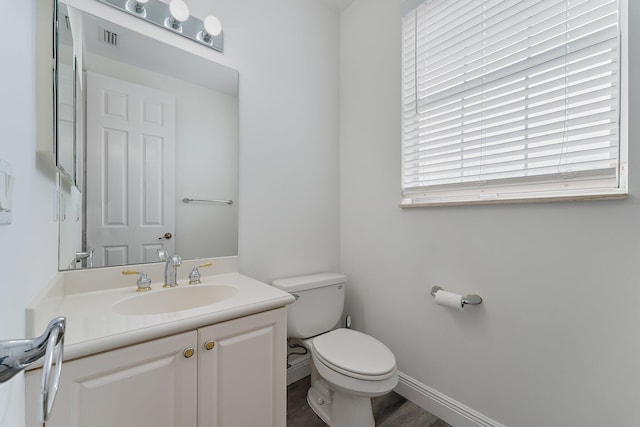 4329 Savannah Bay Pl, Jupiter, FL 33458 - bathroom with toilet, vanity, wood finished floors, and baseboards