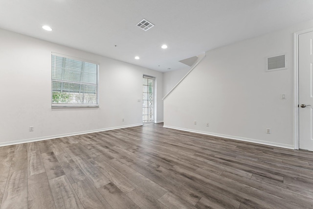 unfurnished living room with wood-type flooring