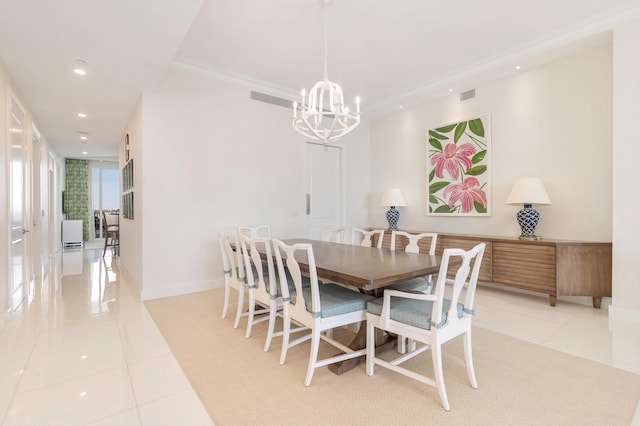 dining space featuring an inviting chandelier, crown molding, and light tile patterned flooring