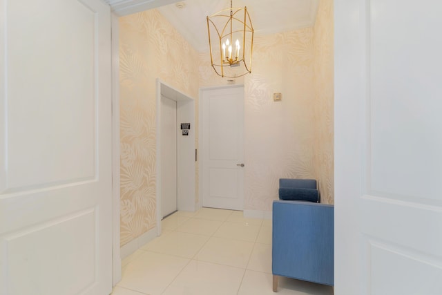 hallway with light tile patterned floors and a chandelier