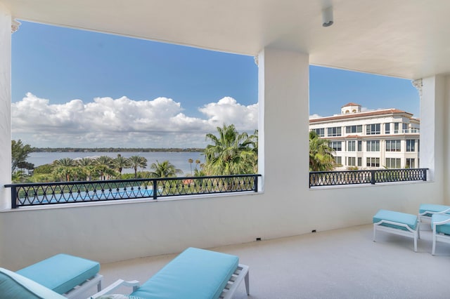 balcony featuring a water view