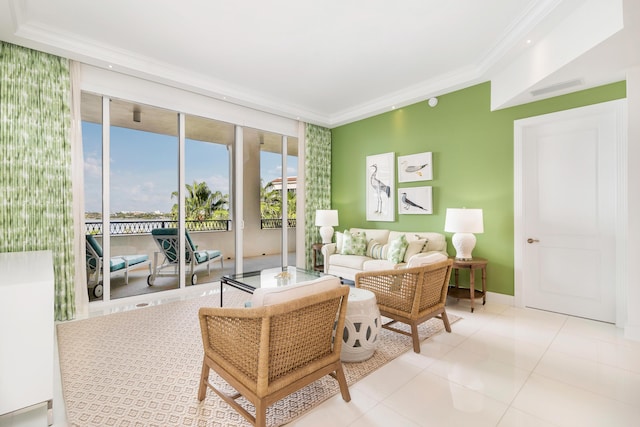 living room with ornamental molding and light tile patterned floors