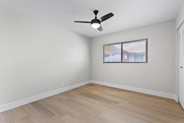 spare room with ceiling fan and light hardwood / wood-style flooring