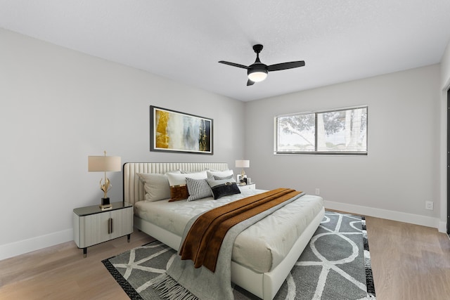 bedroom featuring ceiling fan and light wood-type flooring