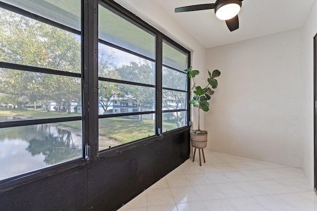 sunroom / solarium featuring ceiling fan