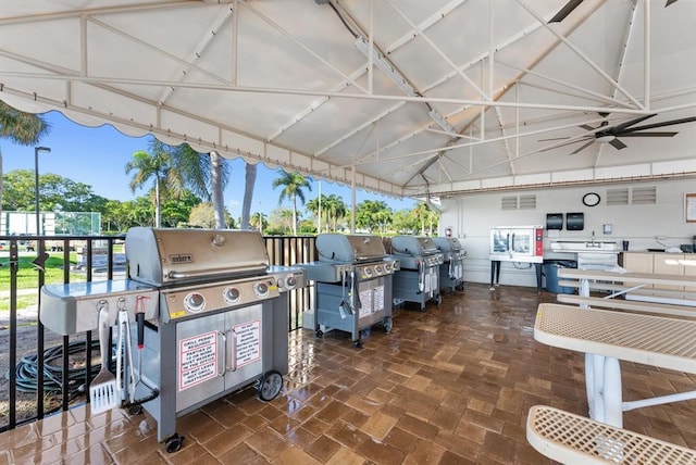 view of patio / terrace with ceiling fan and area for grilling