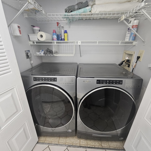 14640 Candy Way, Delray Beach, FL 33484 - laundry room featuring washer and clothes dryer and tile patterned floors