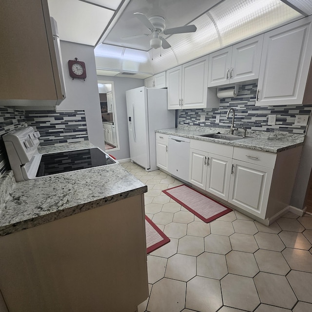 14640 Candy Way, Delray Beach, FL 33484 - kitchen with white appliances, a sink, ceiling fan, backsplash, and white cabinetry