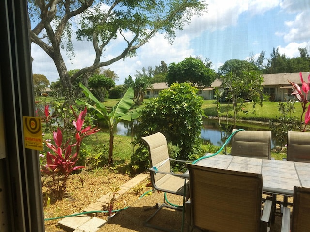 14640 Candy Way, Delray Beach, FL 33484 - view of patio featuring outdoor dining space and a water view