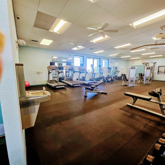 14640 Candy Way, Delray Beach, FL 33484 - exercise room featuring a drop ceiling, baseboards, and a ceiling fan