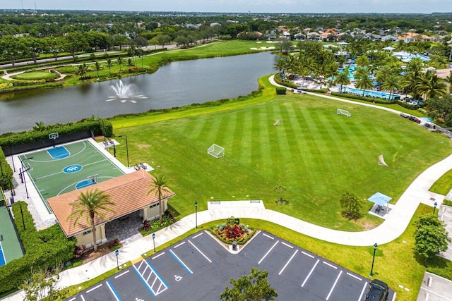 birds eye view of property with a water view