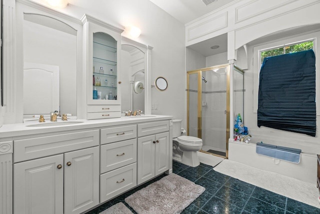 full bathroom with tile patterned floors, vanity, toilet, and separate shower and tub