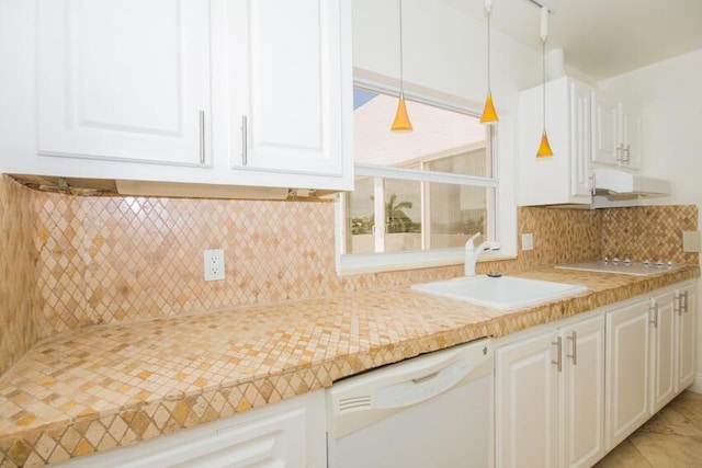 kitchen featuring sink, white cabinetry, decorative light fixtures, white dishwasher, and backsplash