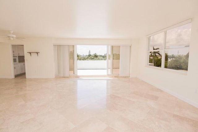 unfurnished room featuring ceiling fan