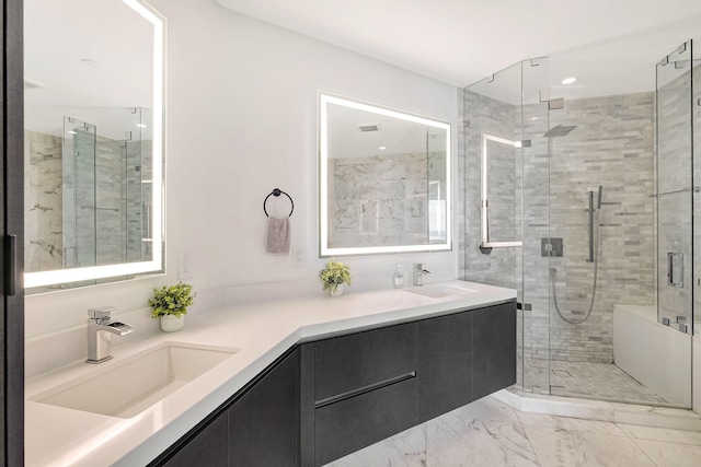 bathroom featuring vanity and a shower with shower door