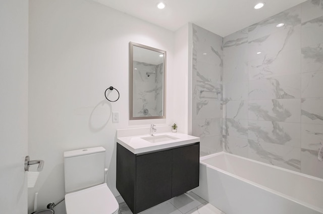 full bathroom featuring vanity, tiled shower / bath combo, and toilet