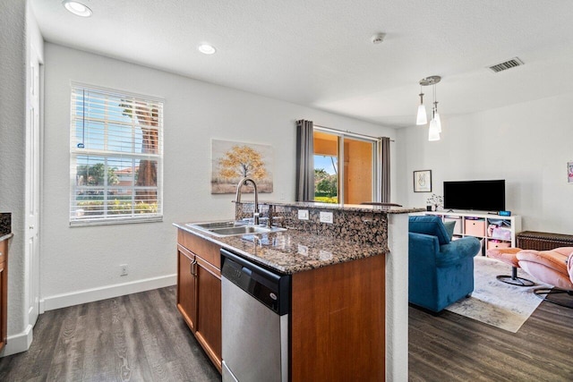 kitchen with sink, decorative light fixtures, dark wood-type flooring, and dishwasher