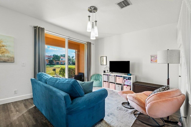 living room with dark hardwood / wood-style flooring