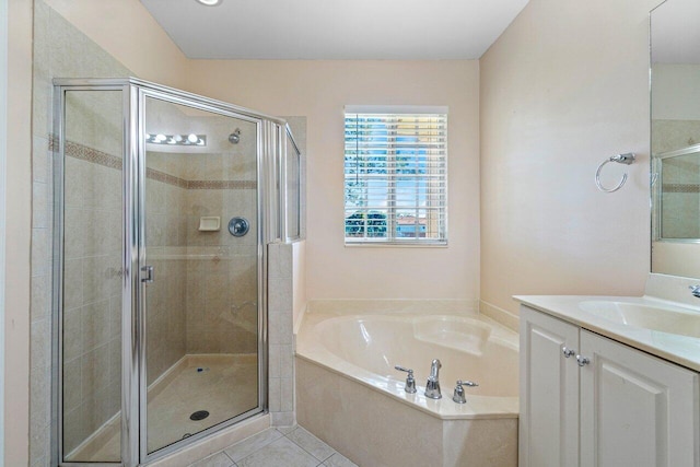 bathroom with tile patterned floors, vanity, and independent shower and bath