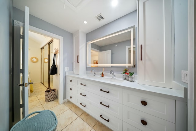 bathroom with vanity and tile patterned floors