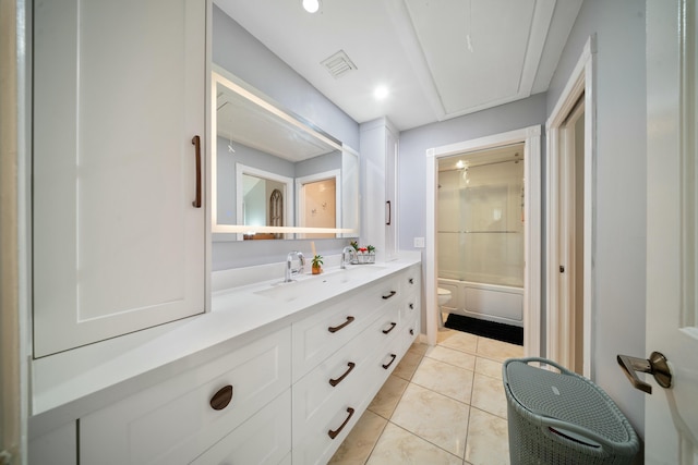 full bathroom with bathtub / shower combination, vanity, toilet, and tile patterned flooring