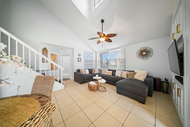 living room featuring high vaulted ceiling, light tile patterned floors, and ceiling fan