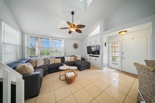 living room featuring high vaulted ceiling, light tile patterned floors, and ceiling fan