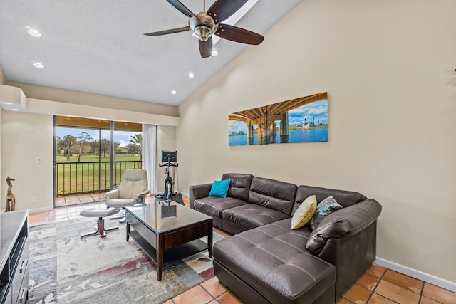 tiled living room featuring vaulted ceiling and ceiling fan