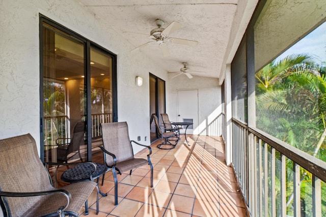 sunroom / solarium featuring ceiling fan